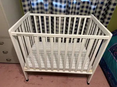 Delta Children Foldable Mini Crib - 2 Levels , View more