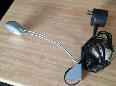 Plug-in mini light for wall-mounting to highlight a frame or spot on the wall. 2 spare bulbs include...