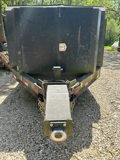 10 ton tri axle dump trailer. 16' long, ramps for loading bobcat or mini ex. Side door to load skids...