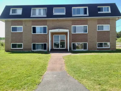 The Salmon River apartment buildings are on spacious grounds that offer lots of green space and outd...