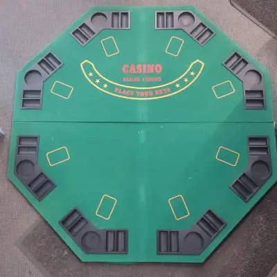 This foldable poker/black jack table top is approx. 48 inches wide, and comes with removable chip ho...