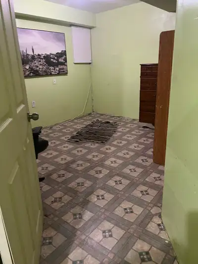 Room in the basement for rent in a family home with a separate bathroom . Share entrance to the base...