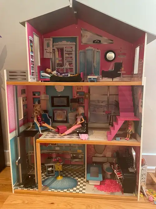 Selling a beautiful Barbie wooden dollhouse in great condition. Sturdy, colorful, and fits most stan...