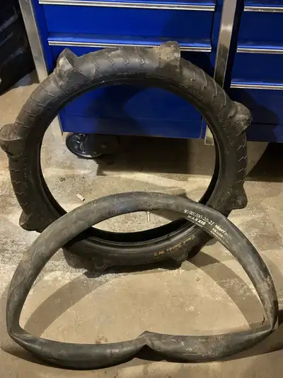Sand snake paddle tire with tube. Size is 110/90-19. Mounted once had very little use.