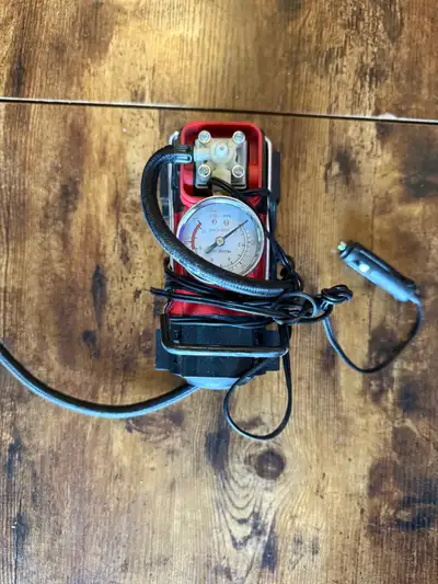 This portable air compressor is a powerhouse in a compact size, featuring a robust motor and a built...