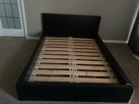 Double-size bed frame with slats