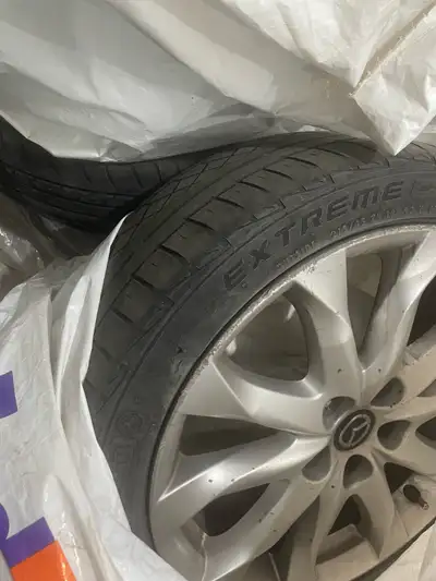 Mazda mags 215/ 45r/ 18 One of the rims is bend a bit Tires are done