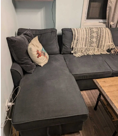 Grey couch for sale. Enough seating room for 3 to 4 people comfortably. Couch pulls out into a bed,...