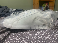 Unopened white sneakers