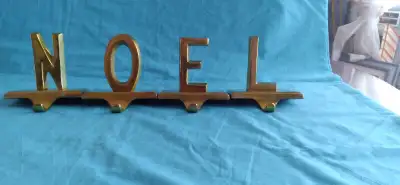 A SET OF 4 VERY HEAVY SOLID BRASS ALPHABETS WHICH CAN SIT ON YOUR GLASS SHELVE WITH A HOOK IN FRONT...