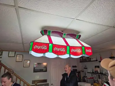 Brighten up your space with this unique Tiffany style vintage Coca-Cola light fixture, perfect for a...