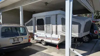 Tent trailer, sleeps 6, with sink, cook top and built-in cooler. Dry while camping in the rain. Dry...
