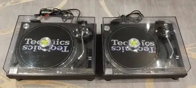Excellent condition Technics SL-1200MK2 black direct drive turntables. Include dust covers, weights...