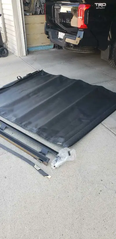 I am selling a tonneau cover from a 2024 Tacoma 6ft box. Used only 2 months. Comes with all parts an...