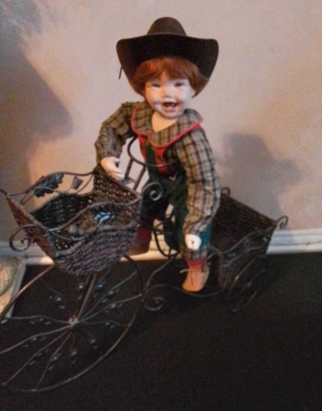 Porcelain Doll with Metal Bike in Home Décor & Accents in St. Catharines