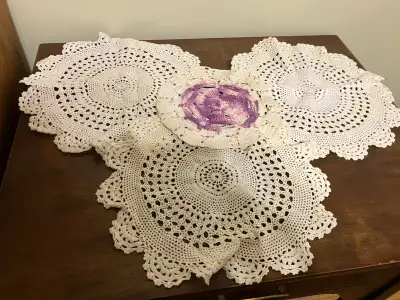 Four beautiful crocheted doilies,, View more