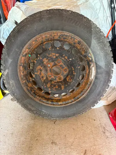 Set of 4 Bridgestone winter tires on rims. Good tread. 195/65R15. Originally on a Chevy sonic.