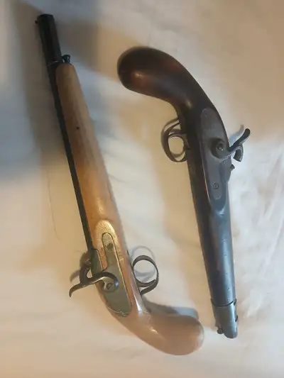 2 replica pistols, one dark brown, one blond. $35 each or $ 60 for both