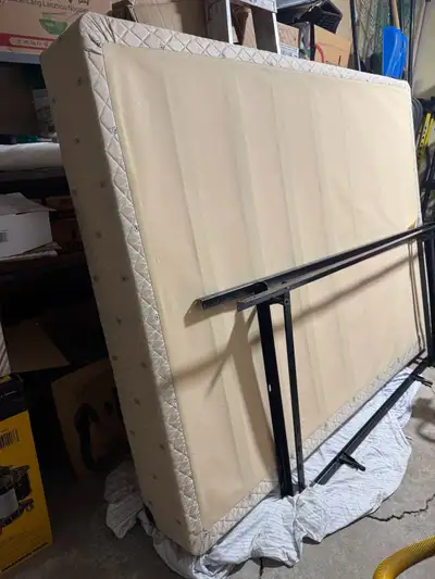 Queen size box spring and metal frame. Excellent condition.