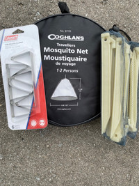 Mosquito net, stakes and table cloth clamps. 