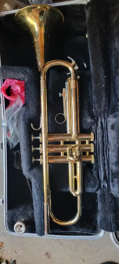 Bundy trumpet Could be from the mid-thirties. Comes in hard case With some accessories. There is som...