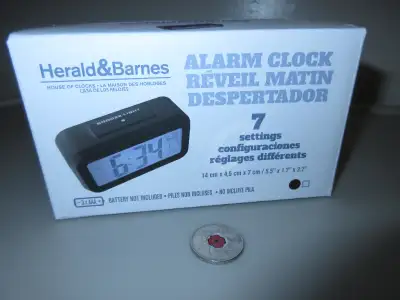 Alarm clock still in box working does not come with batteries., View more