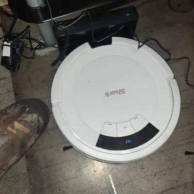 Keep your floors clean effortlessly with this Shark robot vacuum! It's designed to navigate your hom...