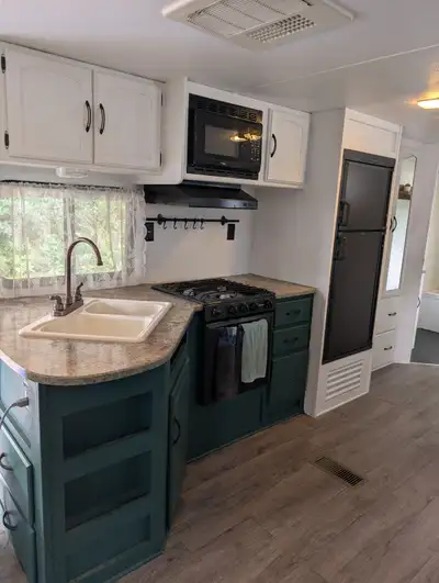 2013 32ft Springdale travel trailer with slide out. Queen sized bed in the front, with space to inst...