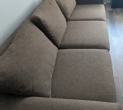 Large brown sofa with ottoman. Sofa is 96"LX23"HX40"D. The ottoman is 34"X27"X16"H. Both are in good...