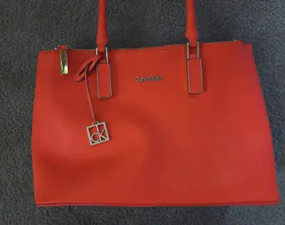 Authentic Calvin Klein Women Handbag. Orange. Slightly worn., View more