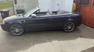 2006 Audi S4 2dr Convertible AWD V8 Auto. Just under 193000 km. Purple in color. Added Nav with b/up...