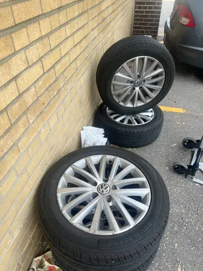 Selling a set of four fairly used Volkswagen rims and tires, size 215 55 R17, perfect for your car....