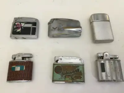 I have eight vintage cigarette lighters for sale. The Players is a Crown. The brown ‘leather’ is a R...