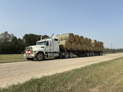 Custom bale hauling B-train trailers Can haul 40 round bales or 72 squares Located west of Red Deer...