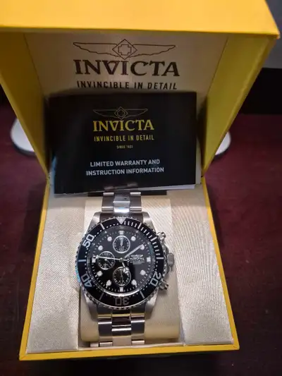 Mint Invicta Stainless Chrono watch. Needs new battery but otherwise mint. I have too many watches s...