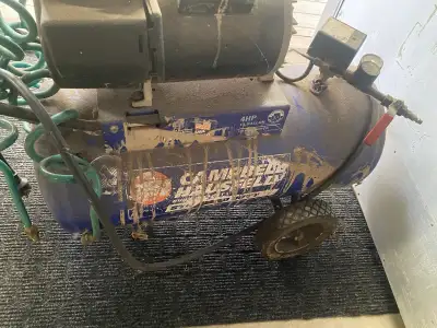 For sale 4 hp Campbell Hausfeld Air Compressor ,,, plugs in works but leaks out of the bottom tank a...