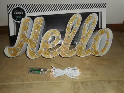 Heidiswapp Marquee “HELLO” light up shaped sign, new in the box. Measures 19” wide x 8” high. Contai...