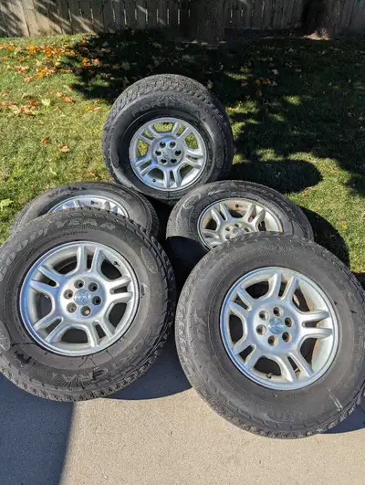 5 Dodge Ram 16 inch Rims. 6 bolt. Two of the tires are like new. One is a Goodyear Wrangler and one...
