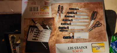 Still in plastic 13 piece special knife set from Germany.briefcase still as number locks. Picture sh...