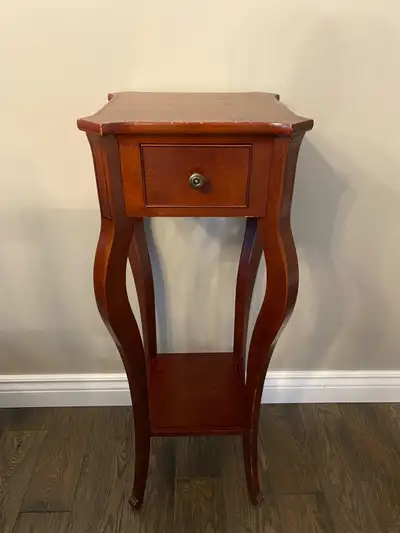 Selling a beautiful vintage wooden side table. Great decorative piece for a hallway, living room, or...