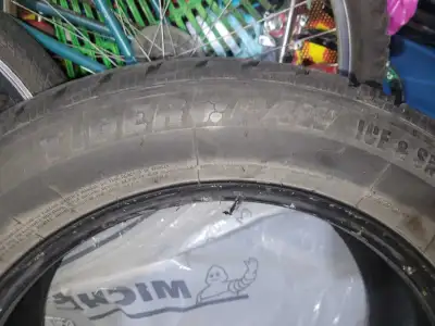 This is a Tiger Paw Ice & Snow II winter tire, size 215/60R17 96T. The tire appears to be in used co...