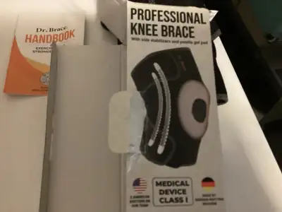 I'm selling a Dr. Brace Professional Knee Brace, designed with side stabilizers and a patella gel pa...