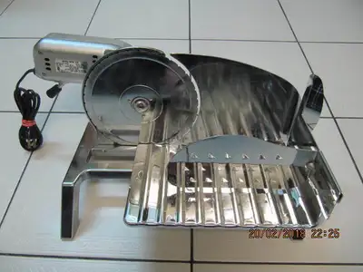 Up for sale is a vintage classic and rare all Stainless Steel Rival Model 1031 Food Slicer manufactu...
