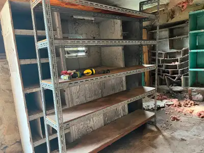 Metal shelving unit . Good for a garage.