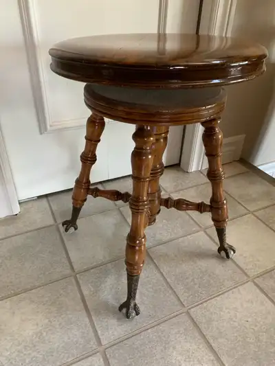 Vintage Piano Stool with claw and glass ball feet. In very good condition.