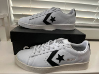 new Converse leather sneakers in mens size 9 or womens size 10.5