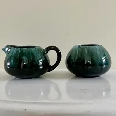 This is a beautiful, used Blue Mountain Pottery cream and sugar set, perfect for adding a touch of C...