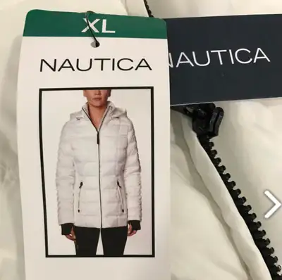 Brand new never worn L/XL white weather resistant winter puff jacket coat with ribbed cuffs and thum...