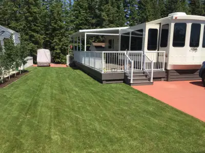 Complete RV Lot and 2015 Cedar Creek 40CCK destination trailer. This setup has a 36’ x 12’ deck with...