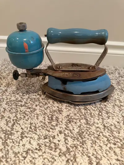 Vintage Colman & Stove Company gas iron. Canadian model 4A. Comes with rest plate.